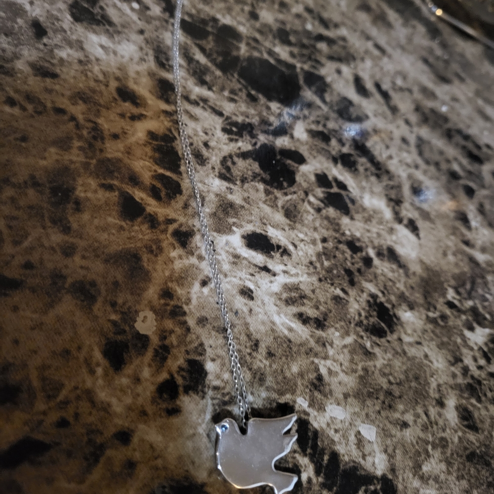 Avon Silver Tone Gem Eye Dove Necklace